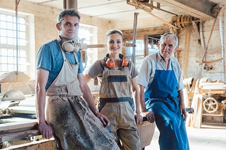Carpenters smiling in a workshop