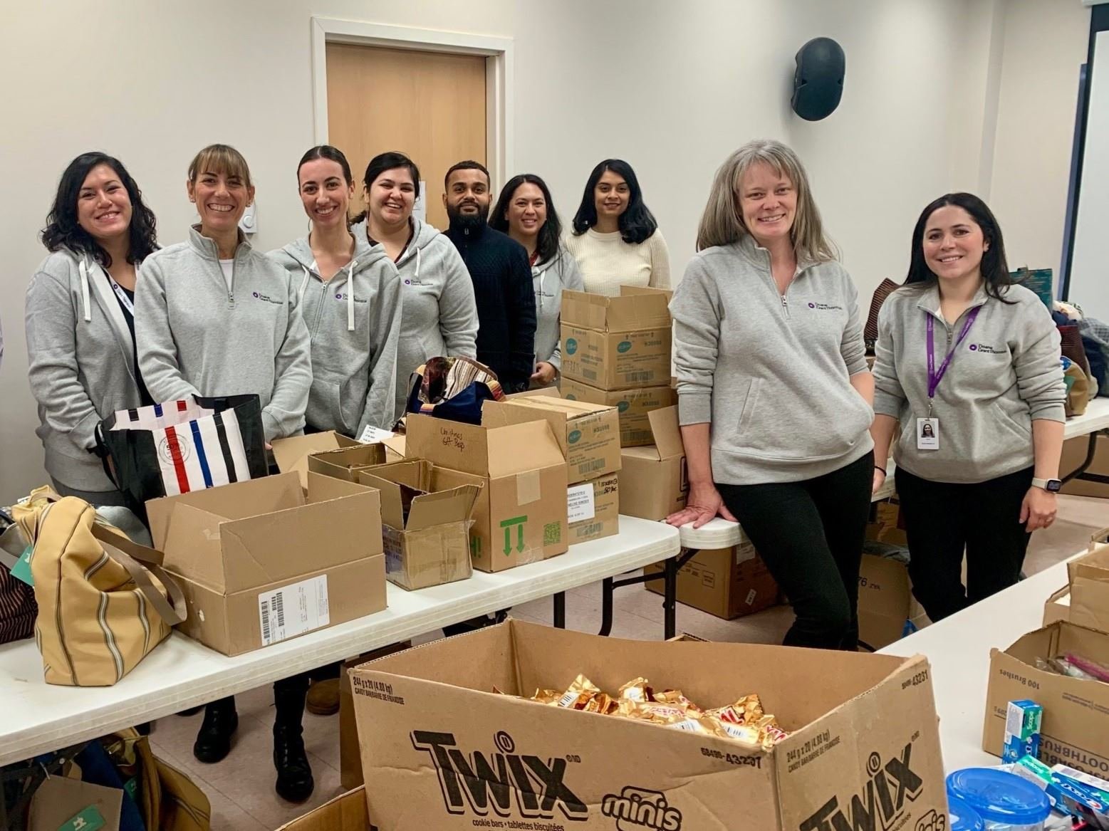 A group of colleagues from Doane Grant Thornton's National office assembling care packages
